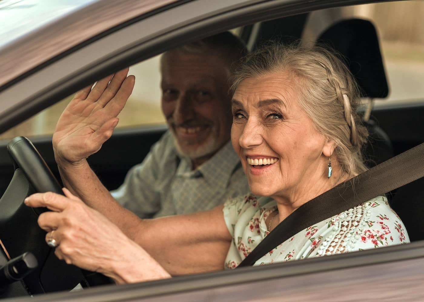 old couple holiday car